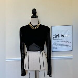Long sleeve, mesh crop top with tie detail. Black colour.